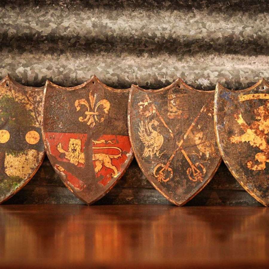A Charming Set Of Toleware Heraldic Shields